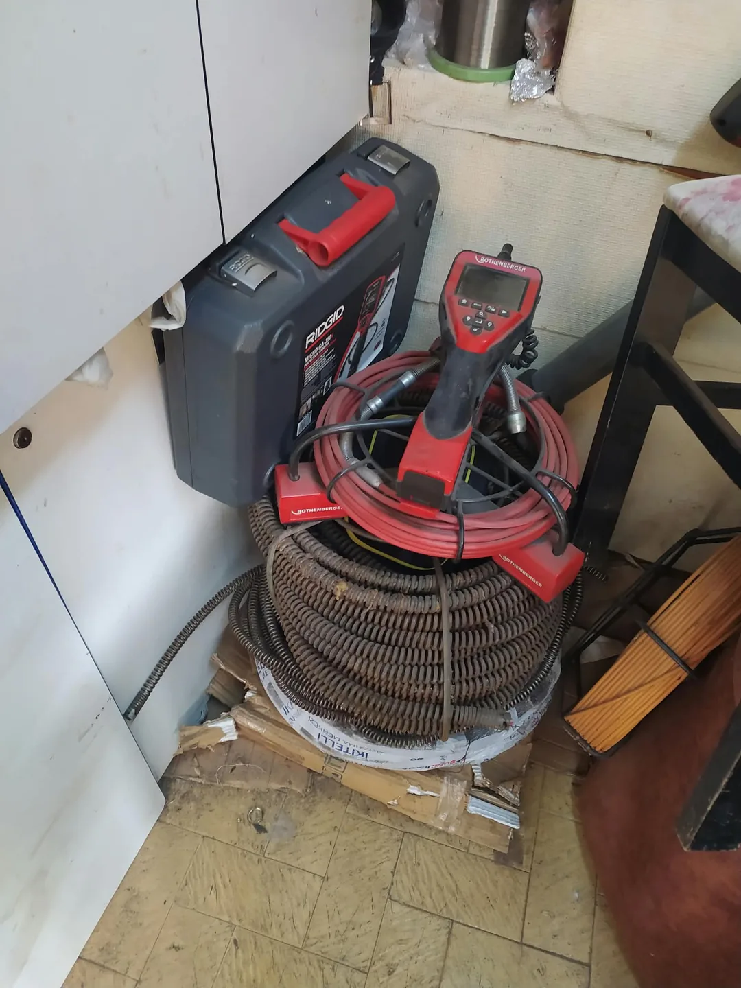 Drain inspection camera, carrying case and drain cleaning cables